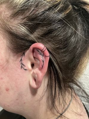 Unique and intricate design of an ear crafted with hand-poked dotwork technique by Marketa.handpoke