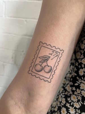 Unique hand-poked design by Marketa.handpoke featuring a delicate cherry motif in dotwork style.