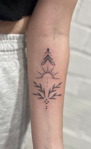 Experience intricate hand-poked dotwork design with a touch of ornamental flair by Marketa.handpoke.
