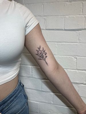 Experience the beauty of hand-poked dotwork and fine line technique with this stunning flower tattoo by Marketa.handpoke.