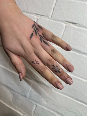 Discover the beauty of hand-poked dotwork in this intricate ornamental tattoo by Marketa. Unique and timeless artistry.