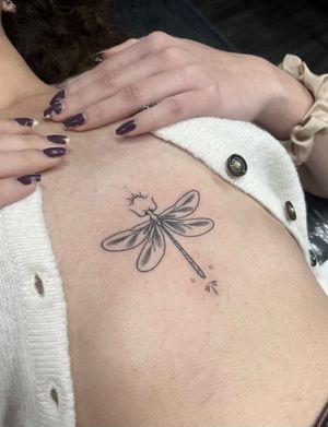 Get a unique dotwork hand poke dragonfly tattoo by Marketa.handpoke for a stunning and artistic body art piece.