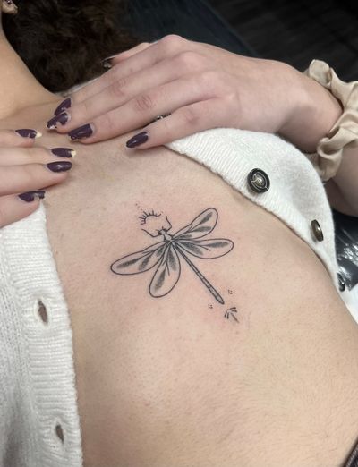 Get a unique dotwork hand poke dragonfly tattoo by Marketa.handpoke for a stunning and artistic body art piece.