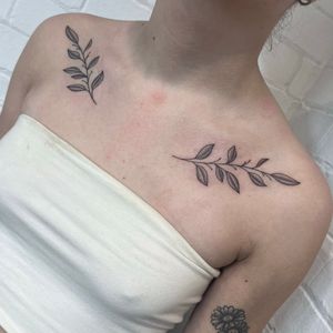 Beautiful and delicate hand-poked dotwork tattoo of a laurel branch, done by Marketa.handpoke.