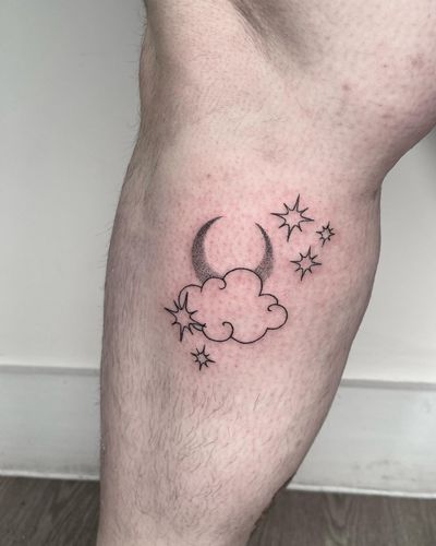 Capture the beauty of the night sky with this intricate hand-poked tattoo featuring a moon, star, and cloud in stunning dotwork and fine line style by talented artist Marketa.