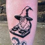 Get enchanted with this illustrative and ignorant wizard DJ tattoo by artist Dave Norman. Let the magic of music and sorcery come alive on your skin!