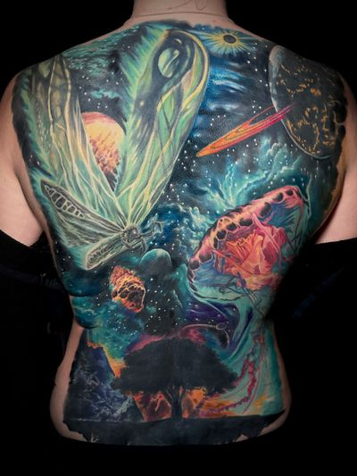 Experience the surreal beauty of a galaxy merging with a jellyfish and tree in stunning full color. Inked by the talented artist Alex Santo.