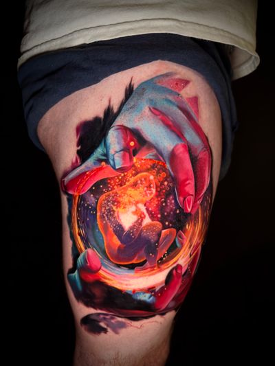 Experience the magic of creation with this stunning watercolor surrealism tattoo by the talented artist Alex Santo.