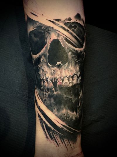 Transform your skin into a masterpiece with a stunning black and grey skull tattoo by artist Alex Santo. Embrace the beauty of darkness.