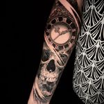 Get inked by Alex Santo with a striking black and gray design featuring a skull and clock motif for a timeless look.