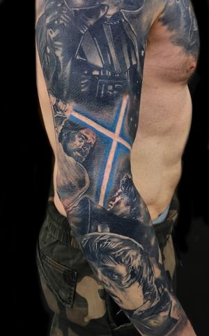 Detailed tattoo featuring Luke Skywalker and Obi Wan Kenobi from Star Wars, done in realism style by artist Craig Hicks.