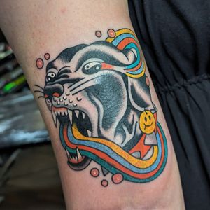 Get fierce with this classic panther design by talented artist Benji Charnock. Bold lines and vibrant colors make this traditional tattoo a standout choice.
