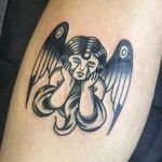 Immerse yourself in the timeless beauty of this traditional style angel tattoo by the talented artist Benji Charnock.