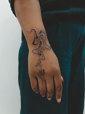 Abstract hand tattoo 