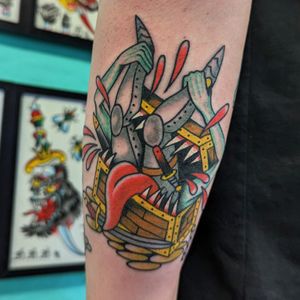 Get a traditional chest tattoo that mimics the style of Benji Charnock, expert in traditional tattoos.