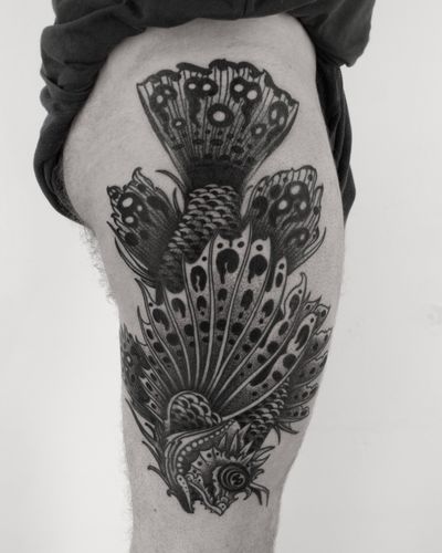 Get inked with a fierce lionfish design by Lukey Wolf, blending medieval and aquatic elements in a unique illustrative style.