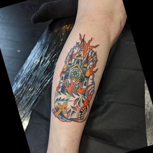 Vibrant traditional tattoo featuring a church engulfed in flames, created by tattoo artist Benji Charnock.