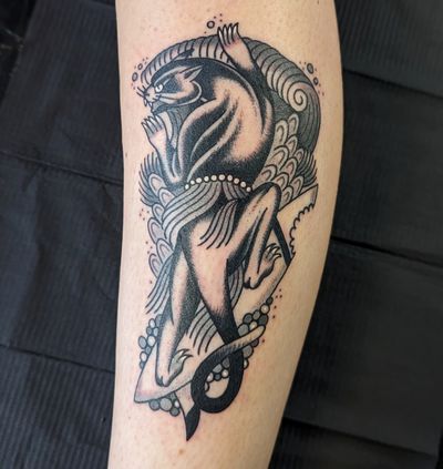 Get a fierce and timeless traditional panther tattoo by the talented artist Benji Charnock. Bold lines and vibrant colors create a striking design.