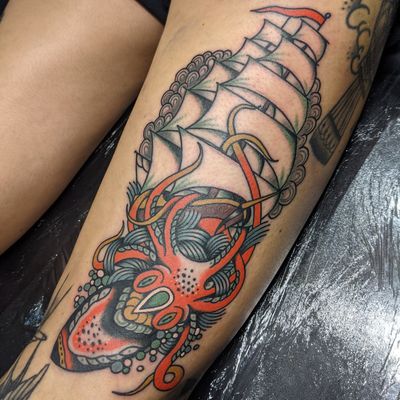 Experience the classic artistry of traditional tattooing with this timeless ship motif by Benji Charnock. Set sail on a journey of self-expression and adventure.