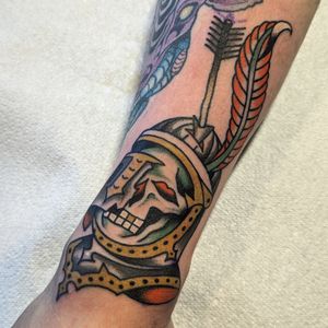 Check out this striking traditional tattoo featuring a knight and skeleton motif by artist Benji Charnock.