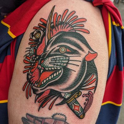 Capture the fierce spirit of the panther with this classic traditional style tattoo by renowned artist Benji Charnock.