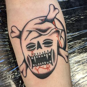 Embrace the timeless allure of a traditional skull tattoo by the talented artist Benji Charnock. Perfect for those who appreciate classic tattoo designs with a modern twist.