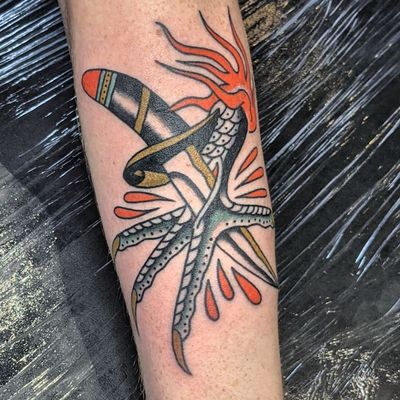 Get a classic traditional dagger tattoo done by the talented artist Benji Charnock. A timeless piece for your collection.