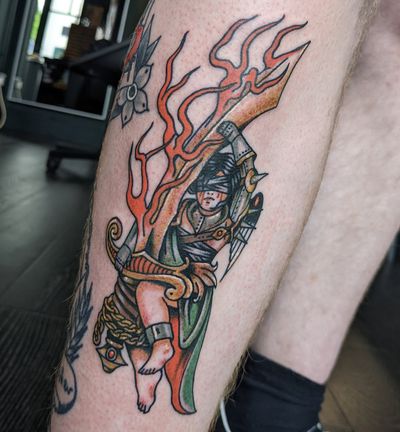 Traditional tattoo of a knight's sword by artist Benji Charnock, featuring intricate details and bold lines.