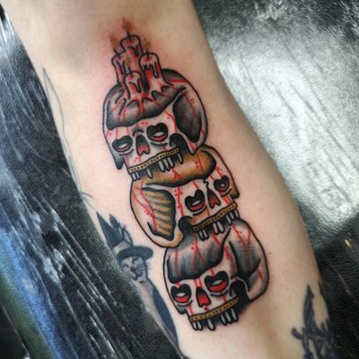 Incredible traditional tattoo featuring a skull and candle motif, expertly crafted by the talented artist Benji Charnock.