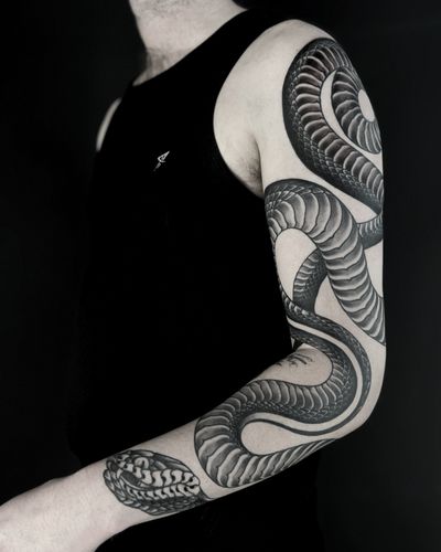 Get a stunning illustrative snake tattoo done by the talented artist Lukey Wolf. A unique and intricate design that will make a bold statement.