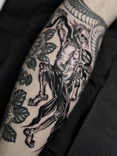 Embrace the mystical world of Japanese yokai with this stunning tattoo by talented artist Lukey Wolf. Let the ancient spirits come to life on your skin.