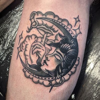 Experience the beauty of traditional tattooing with this stunning design featuring clouds and a moon done by the talented artist Benji Charnock.