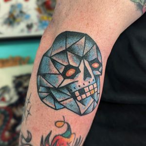 Get a classic traditional skull tattoo done by the talented artist Benji Charnock for a timeless and bold look.