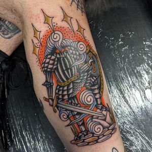 Embrace the medieval spirit with this classic traditional tattoo featuring a knight in shining armor, expertly crafted by Benji Charnock.