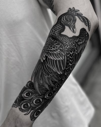 Capture the beauty and elegance of a medieval peacock with this illustrative tattoo by Lukey Wolf. Perfect for those who appreciate intricate designs.