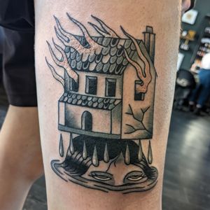 Get inked with a classic traditional house design by talented artist Benji Charnock. Timeless and bold, this tattoo will make a statement.
