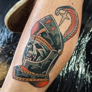 Check out this traditional tattoo featuring a knight facing off against a fearsome skeleton, by artist Benji Charnock.