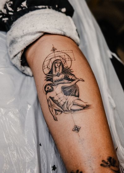 Gabriele Edu beautifully combines fine line and geometric elements to depict the iconic figures of Jesus and Mary in a unique illustrative style tattoo.
