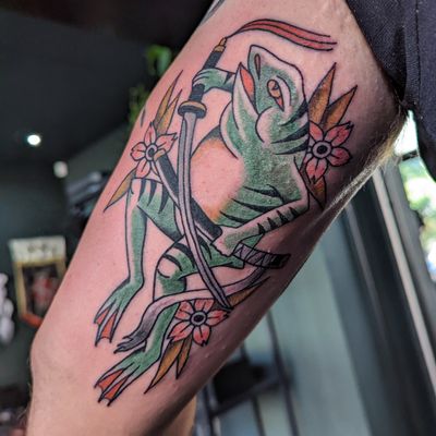 Experience the timeless artistry of a traditional frog tattoo by renowned artist Benji Charnock. This classic design brings luck and symbolism to life with vibrant colors and expert craftsmanship.