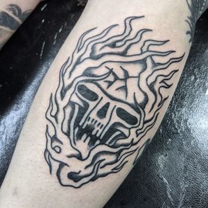 Get a classic and bold traditional skull tattoo design by skilled artist Benji Charnock. Stand out with this timeless motif!