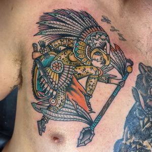Embrace the ancient spirit of the Mayan warriors with this traditional tattoo by Benji Charnock. Bold lines and vibrant colors bring this fierce warrior to life.
