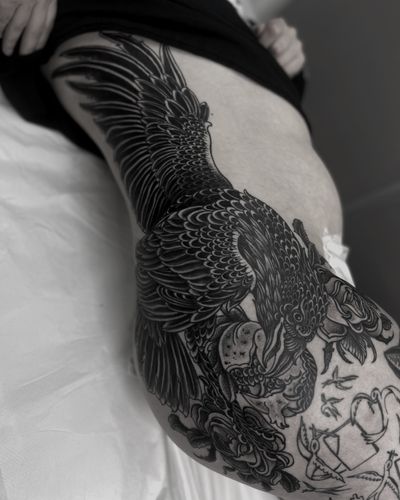 Check out this stunning illustrative tattoo featuring a bird and pomegranate motif, expertly done by Lukey Wolf.