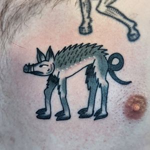 Get a timeless tattoo of man's best friend with this classic traditional style design by renowned artist Benji Charnock.
