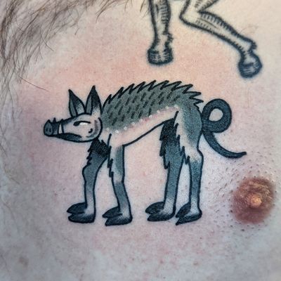 Get a timeless tattoo of man's best friend with this classic traditional style design by renowned artist Benji Charnock.