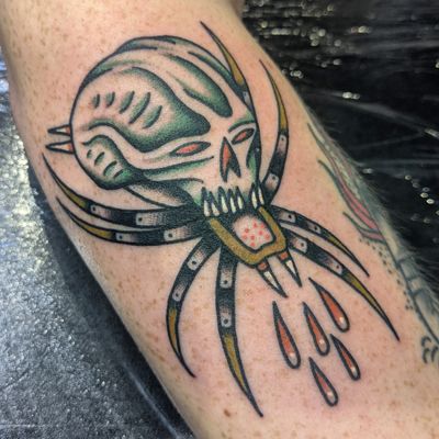 Get inked by Benji Charnock with a bold and classic design featuring a spider and skull motif in traditional style.