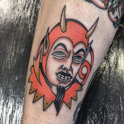 Get a bold and classic devil tattoo by the talented artist Benji Charnock, known for his traditional style.