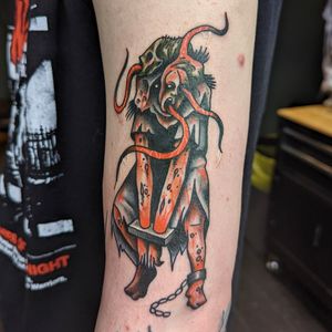 Get a timeless traditional monster tattoo by talented artist Benji Charnock. Perfect for those who love classic tattoo motifs.