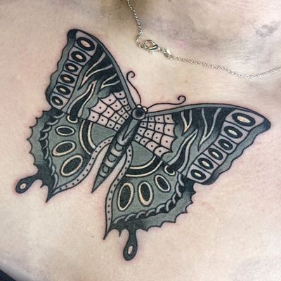 Embrace the classic beauty of a black & gray butterfly tattoo expertly crafted by renowned artist Benji Charnock.