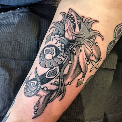 Experience the power and beauty of a traditional Japanese shark tattoo done by the talented artist Benji Charnock.