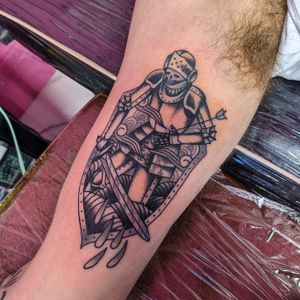 Get armored with this striking knight tattoo by Benji Charnock. Stand tall and brave like a medieval warrior.